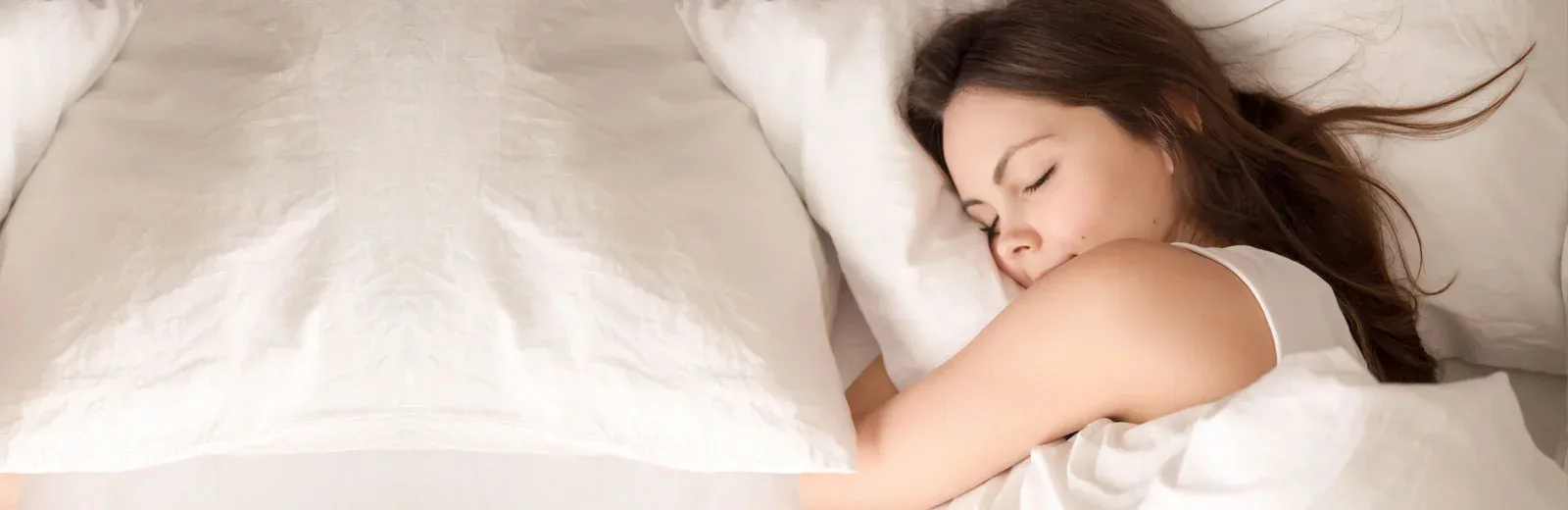 Woman sleeping peacefully in bed bug free bed